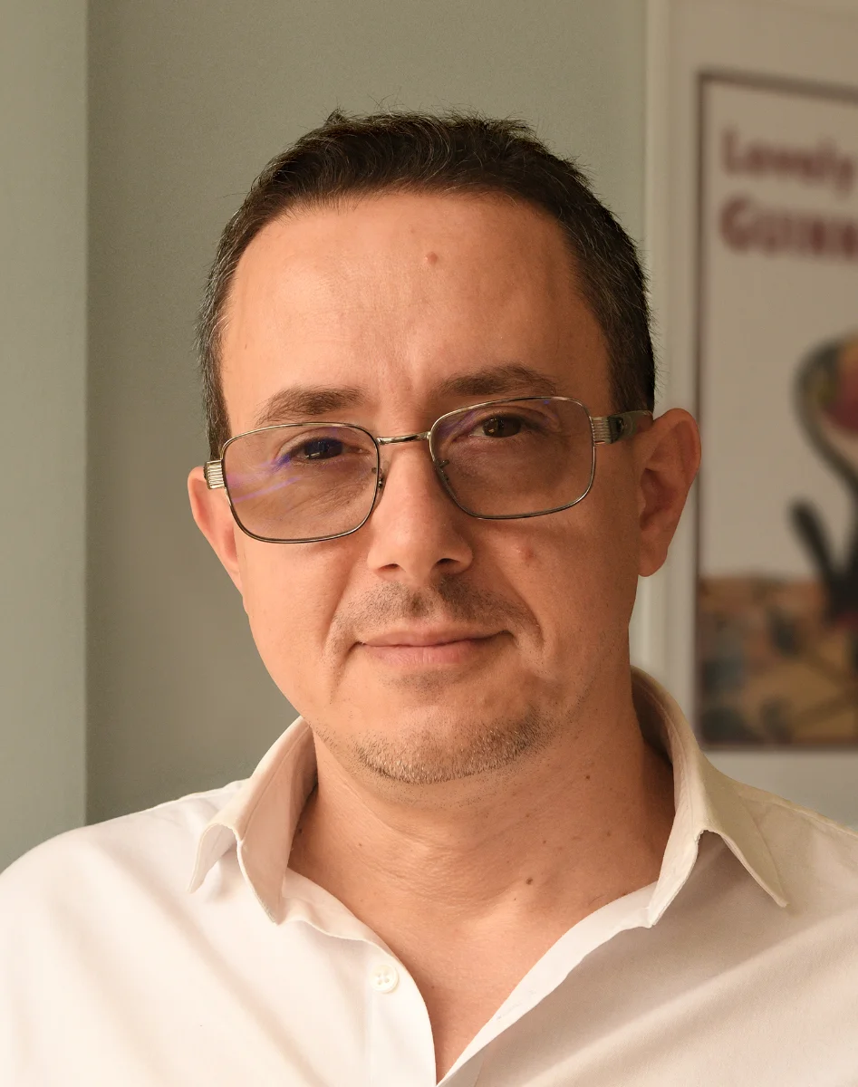 Portrait of Hristo Karakerezov at his design desk